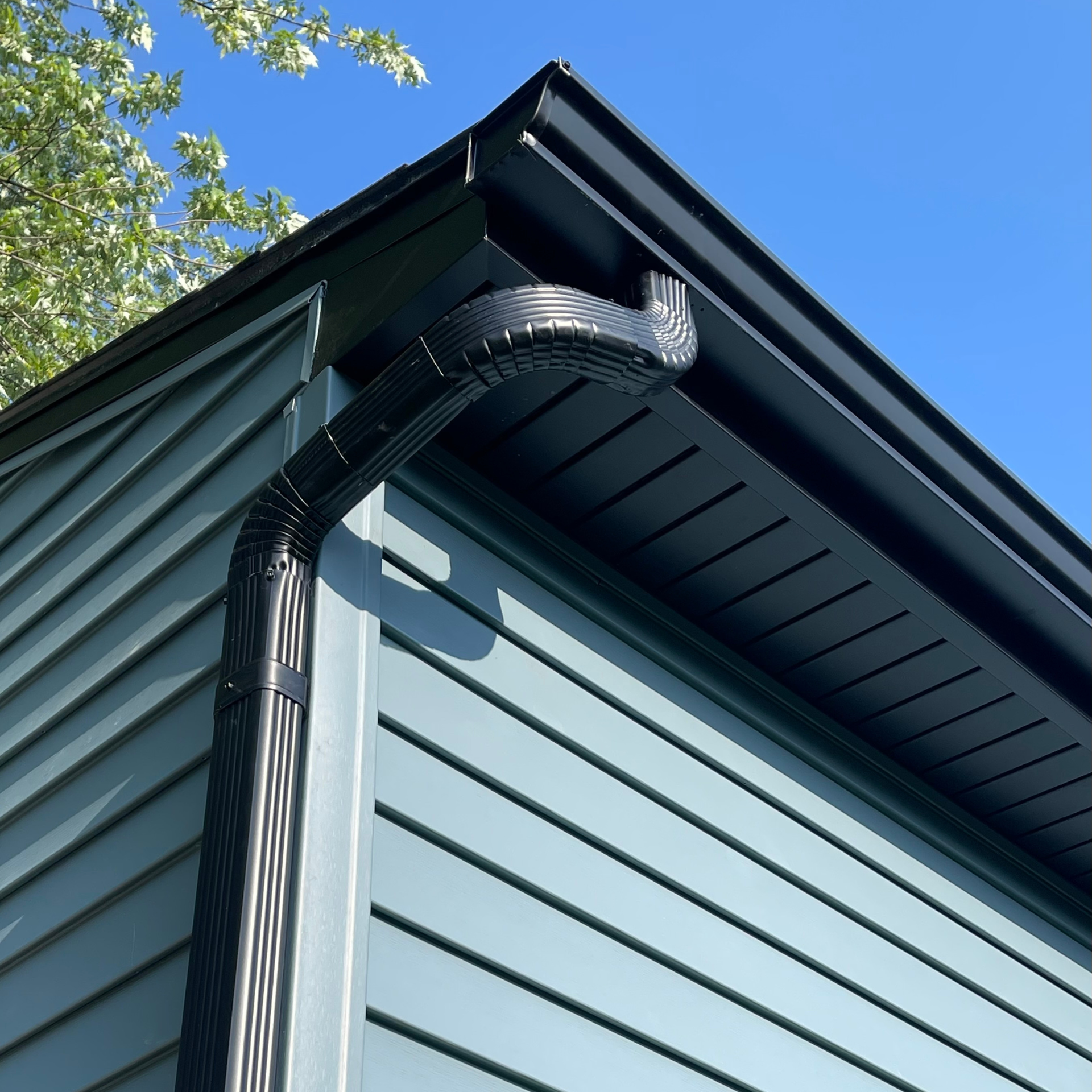 Seamless aluminum gutter system installed on a residential roof in Buffalo, NY, ensuring efficient water drainage and protection against water damage – Amaru Roofing.